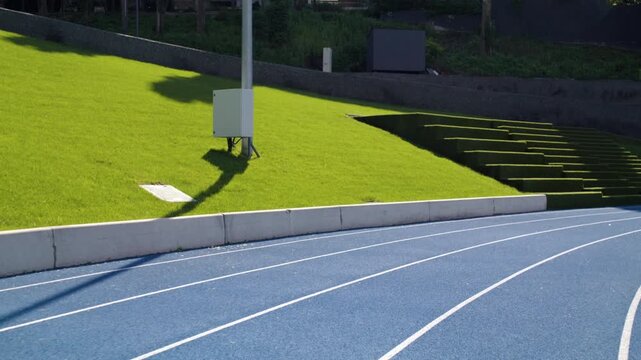 Trainer runs with sportsman using bionic leg prosthesis on track