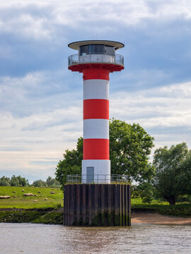 Front light at Stadersand, port of the Hanseatic City of Stade, Germany. Lighthouse at the mound of Schwinge river.