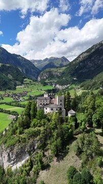 Cinematic Drone Footage of Austrian Castle and Alpine Mountains &ndash; Historic Landmark and Scenic Landscape
