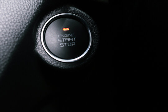 Engine start stop button in a modern car interior. concept transport travel.