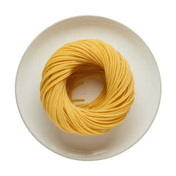 A circular nest of raw yellow spaghetti pasta arranged neatly on a plain white ceramic plate, viewed from directly above on a black surface