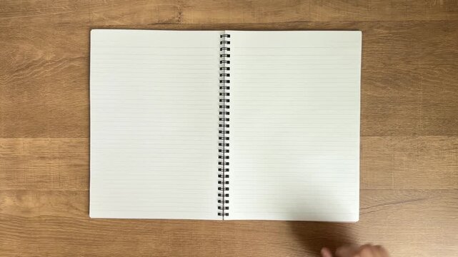 Child Hand Hesitating Over Blank Notebook, 4K
