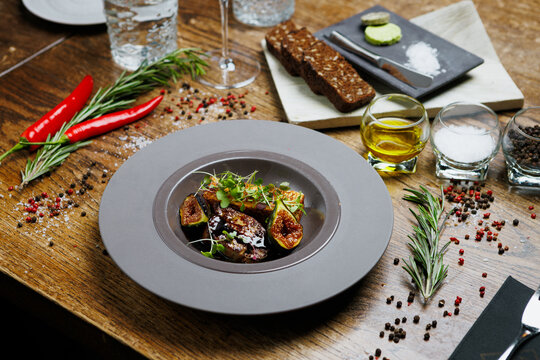 Gourmet foie gras dish served on a rustic wooden table