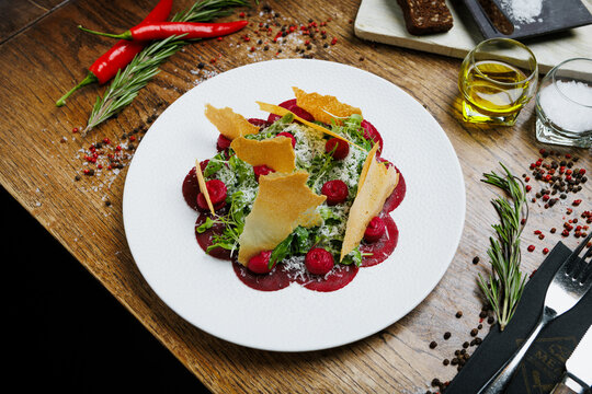 Healthy beet appetizer with crispy bread and microgreens