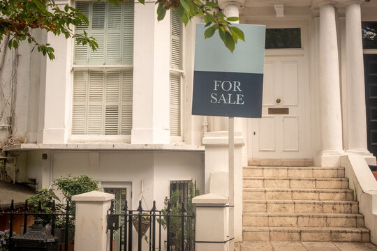 LONDON - for sale sign outside upmarket Kensington property