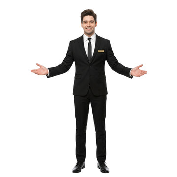 Smiling man in black suit welcoming guests, isolated on white background
