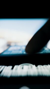 Person's finger rapidly scrolls through an endless social media news feed on a smartphone screen. Macro shot with shallow depth of field creates a motion blur effect, symbolizing information overload.