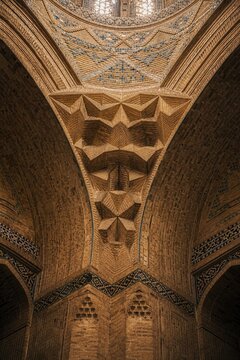 Intricate brick squinch supporting a dome in an Islamic mosque.