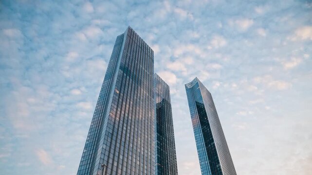 timelapse of fast moving clouds in the sky at sunset over Capital Towers in Moscow