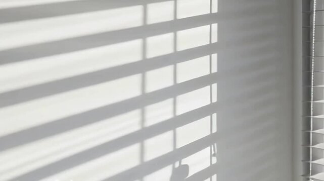 Window blinds creating moving line patterns as light shifts through the room, producing elegant shadows and a minimalist architectural atmosphere, created with Generative AI.