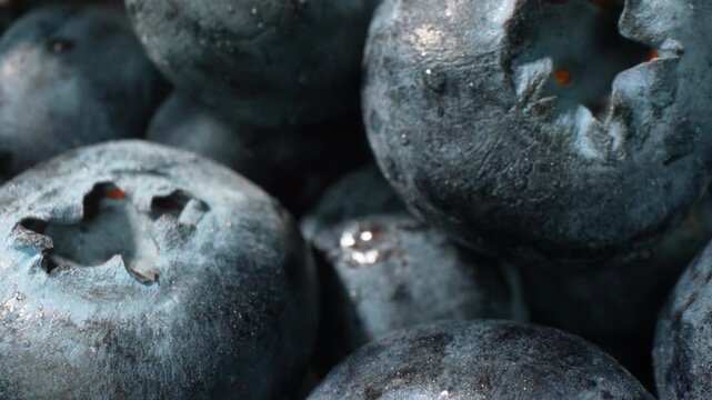 Macro view of ripe blueberries highlighting smooth skin, natural freshness, and vibrant color. Perfect for organic food themes, healthy eating promotions, and premium fruit photography. 4k.
