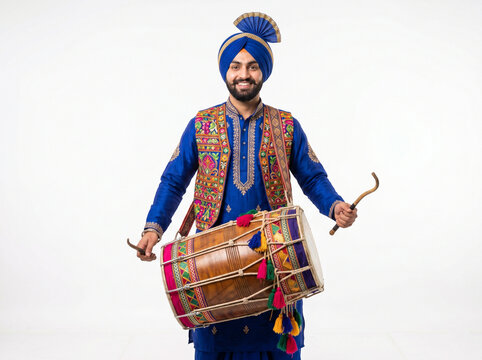 sikh indian man performing with traditional dhol for punjabi festival cultural heritage and baisakhi concept