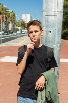 Teenager walking through the city, outdoors