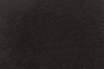 Textured black background with a subtle, rough surface pattern. © Rawpixel.com