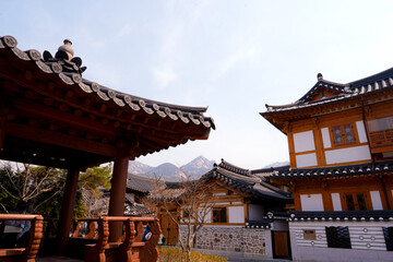 Fototapeta premium Traditional Korean hanok village houses with wooden architecture and tiled roofs