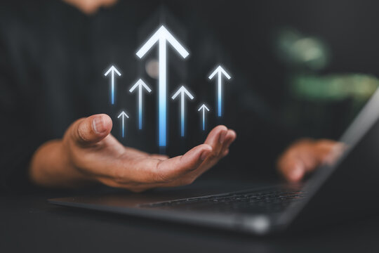 Business goals concept with businessman indicating rising arrows and target icon, representing future growth, strategic planning, success vision, and performance enhancement.