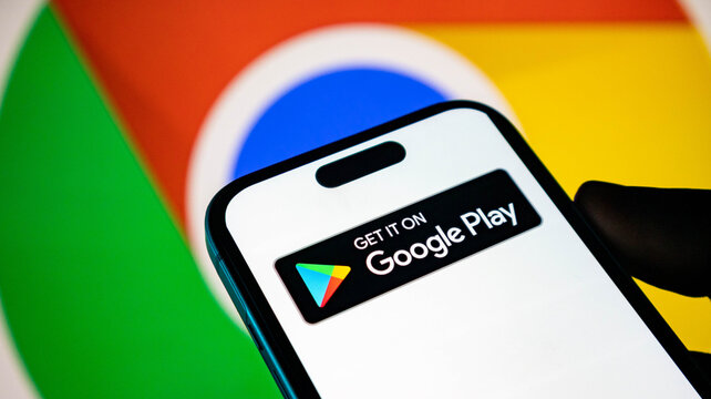 Smartphone displaying the google play store download button against a google chrome logo background