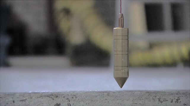 The plumb bob, also called tile plumb bob, can be used to determine whether a line or plane is vertical. Shipbuilding industry at the shipyard. Building a superyacht. Aluminium hull. Skeleton of a shi