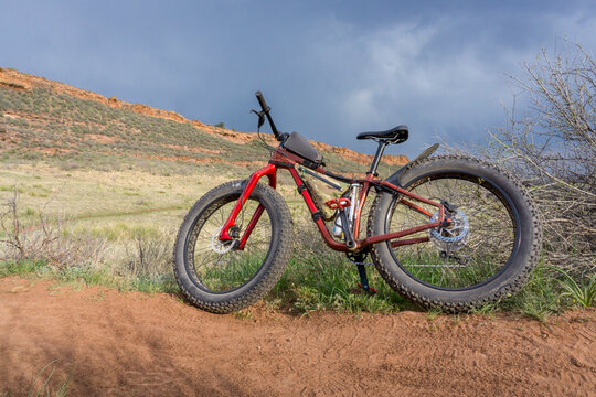 fat mountain bike on a trail in grassy foothills of Colorado, spring scenery