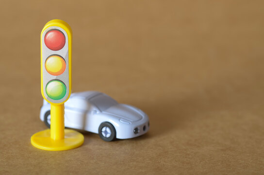 Traffic Regulation and Automotive Safety Concept with Toy Car and Signal