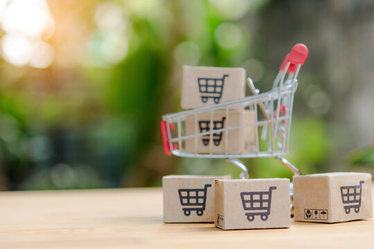 Online shopping cart cardboard box retail sale commerce concept delivery service e commerce market basket purchase order product package