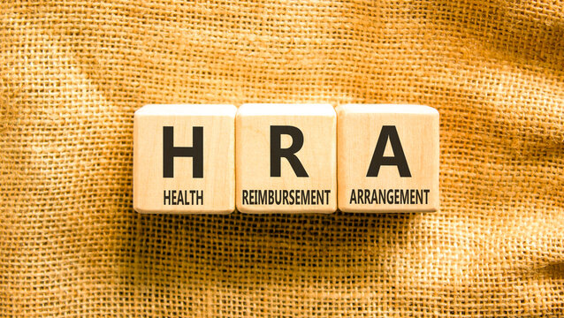 HRA health reimbursement arrangement symbol. Concept words HRA health reimbursement arrangement on beautiful wooden blocks. Beautiful canvas background. Medical HRA concept. Copy space.