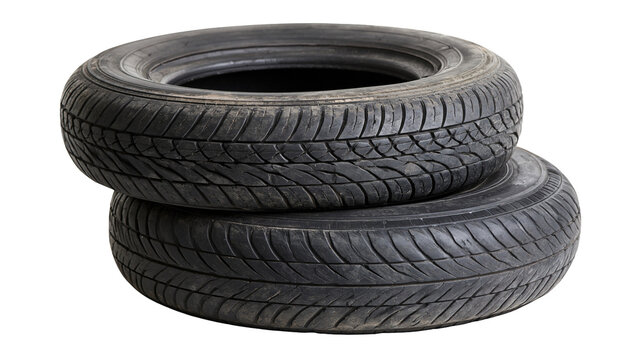 Two black rubber car tires stacked