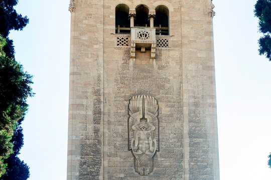 Jerusalem, Israel, June 13, 2026. The majestic limestone bell tower of the Jerusalem International YMCA rising high into a deep blue cloudless sky.