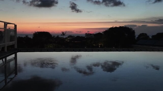 sunset at a rooftop pool in kuta on bali