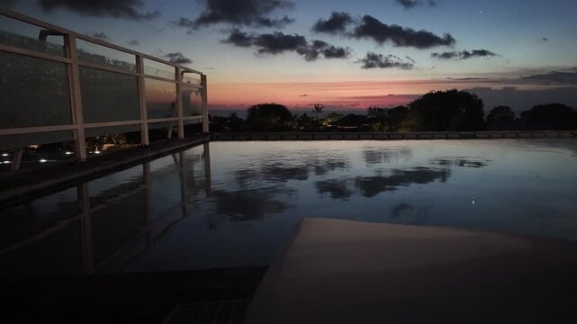 sunset at a rooftop pool in kuta on bali
