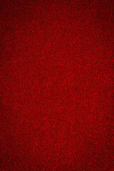Fototapeta premium Bright red texture covers a surface, showing a smooth and uniform appearance in the center of a space