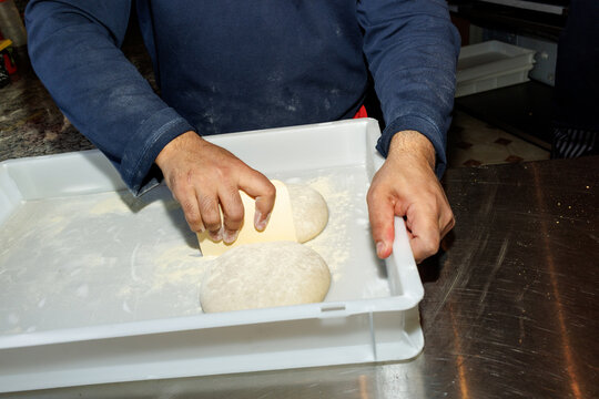 Preparing pizza dough 