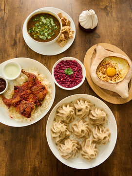 Lunch spread of khachapuri, khinkali, pkhali and chicken georgian food