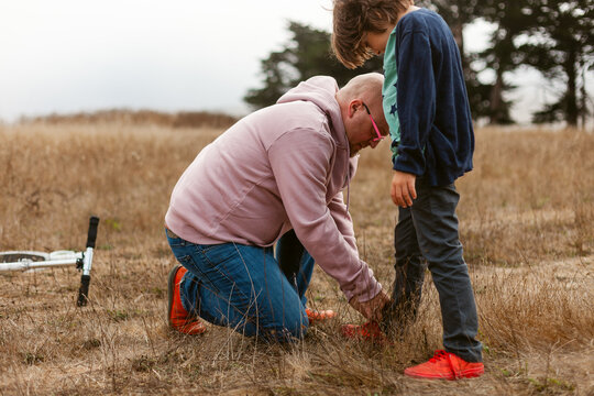 Father Helping Shoes