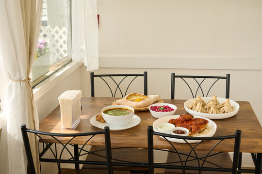 Lunch spread of khachapuri, khinkali, pkhali and chicken georgian food