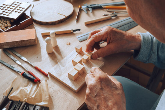 Senior carpenter working with wood.