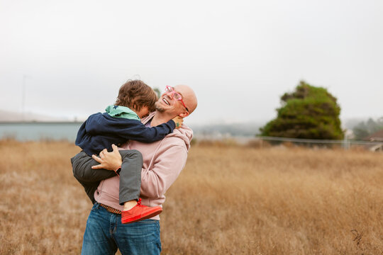 Laughing Father Son Hug