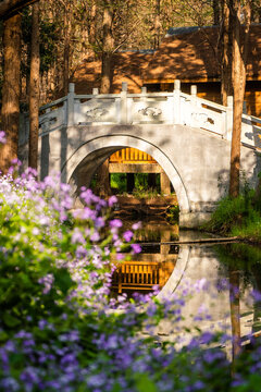 Stone arch bridge over pond 