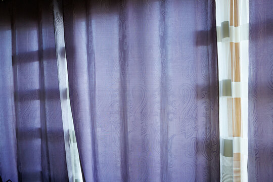 The purple curtains are drawn