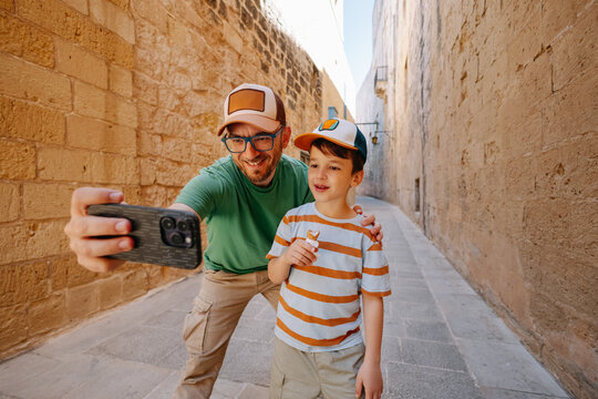Father and son making selfie