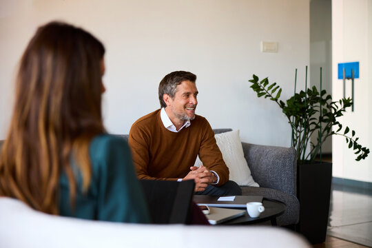 Colleagues talk business in a cozy workspace