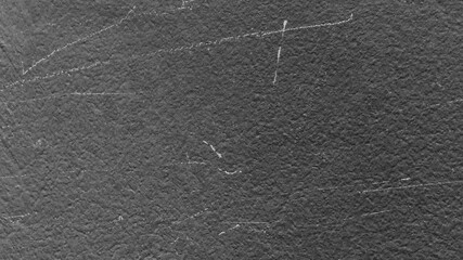 Fototapeta premium Dark gray textured desktop wallpaper with subtle scratches and a rough, stone-like appearance