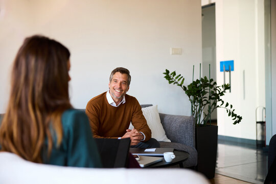 Colleagues talk business in a cozy workspace