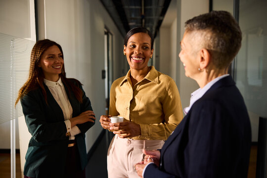 Women in business conversing in the office 