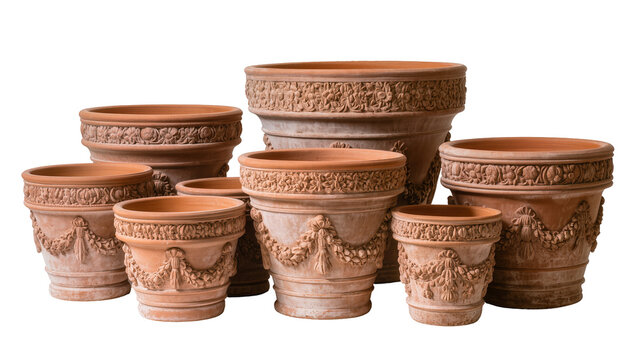 Collection of ornate terracotta garden planters with relief decorations