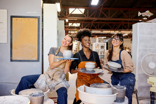 Women Engage in Pottery Making