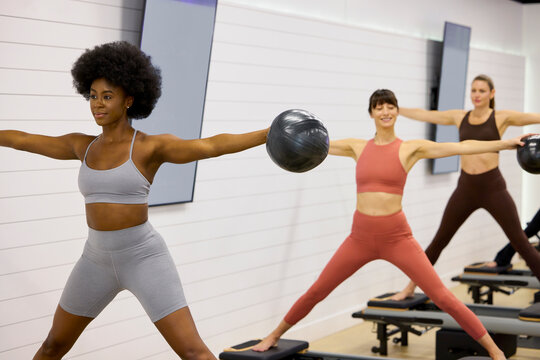 Women Exercise in a Gym During a Fitness Class