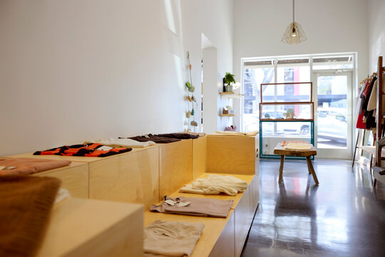 Clothes Displayed Inside a Modern Retail Store