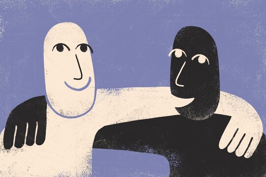 Two multiracial men hugging 