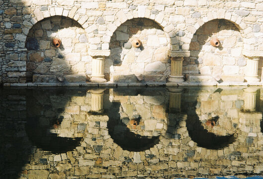 Water Reflections at a Stone Wall in a Quiet Place